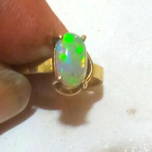 Elegant Opal Ring in Gold Setting